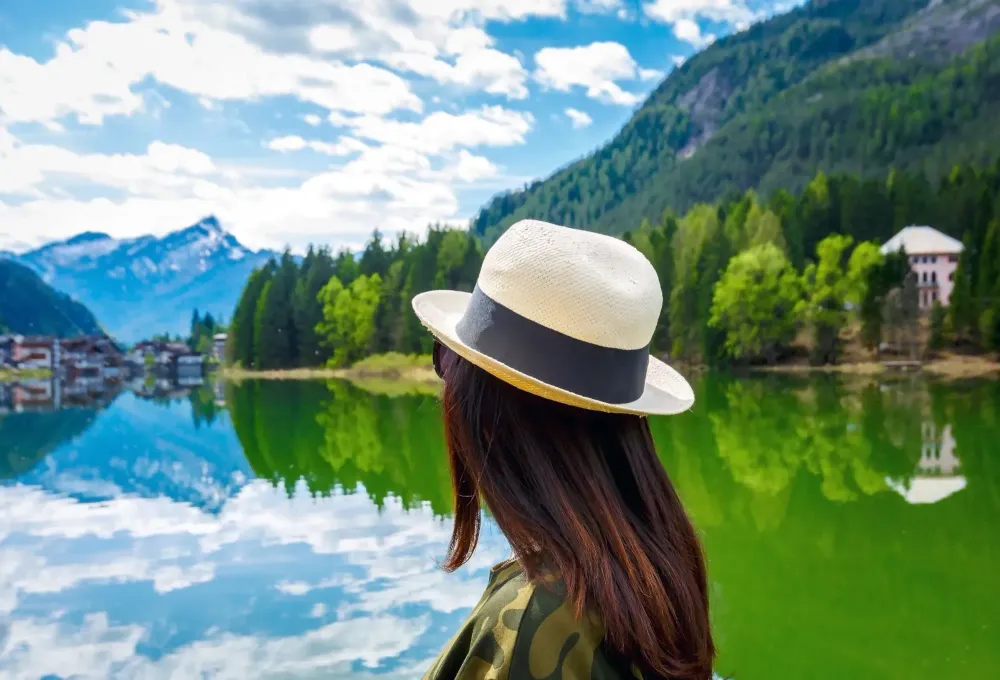 female traveler looking out at lake.